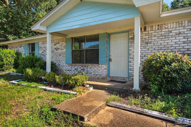 entrance to property with a porch