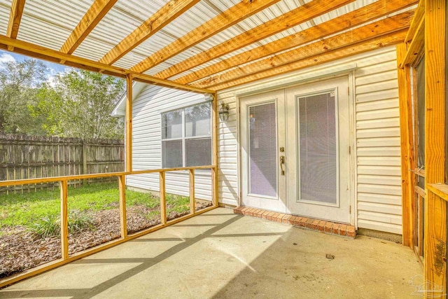 unfurnished sunroom featuring french doors