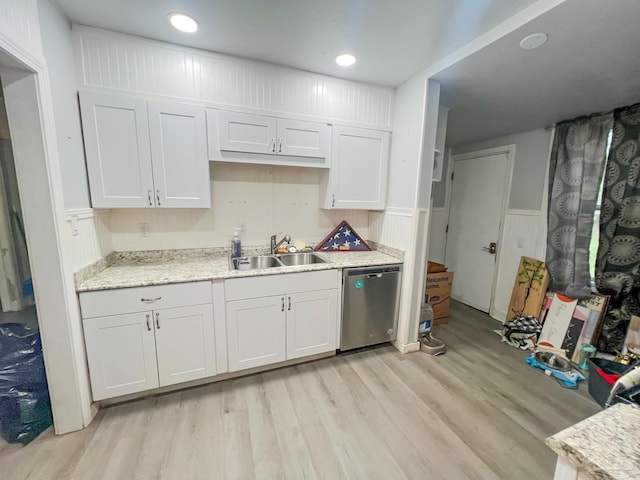 124 Mintz Ln, Cantonment, FL 32533 - kitchen with white cabinetry, light wood-type flooring, dishwasher, and a sink