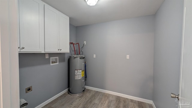 6818 Roundup Ln, Milton, FL 32570 - laundry area with cabinet space, water heater, electric dryer hookup, light wood finished floors, and baseboards