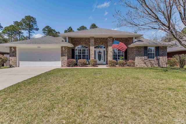 9763 Harlington St, Cantonment, FL 32533 - single story home featuring brick siding, driveway, an attached garage, and a front yard