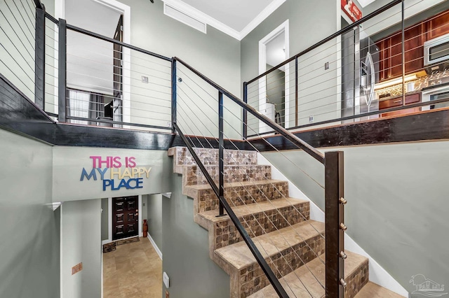 13928 River Rd Unit 904, Pensacola, FL 32507 - stairway featuring ornamental molding