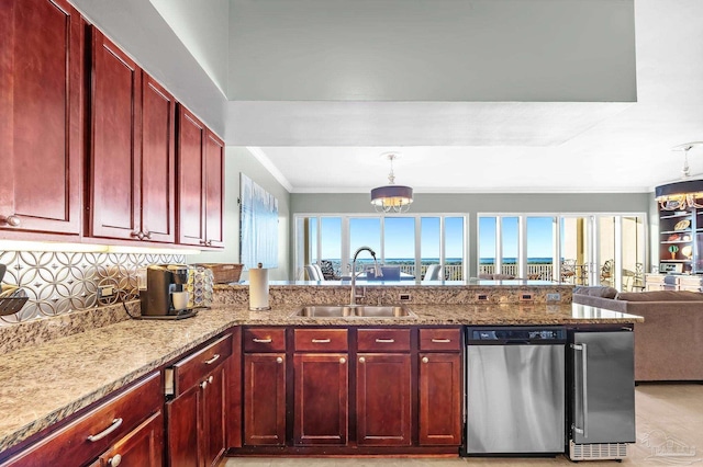 13928 River Rd Unit 904, Pensacola, FL 32507 - kitchen featuring a sink, dark brown cabinets, a wealth of natural light, and appliances with stainless steel finishes