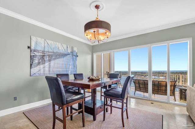 13928 River Rd Unit 904, Pensacola, FL 32507 - dining room featuring baseboards, a chandelier, and crown molding