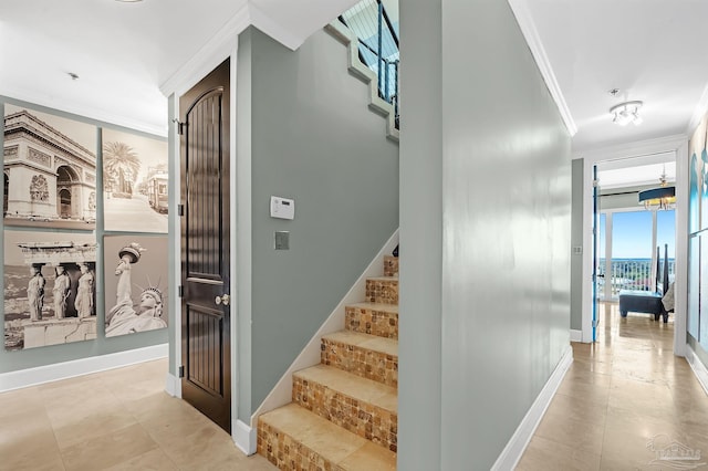 13928 River Rd Unit 904, Pensacola, FL 32507 - staircase with tile patterned floors, baseboards, and ornamental molding