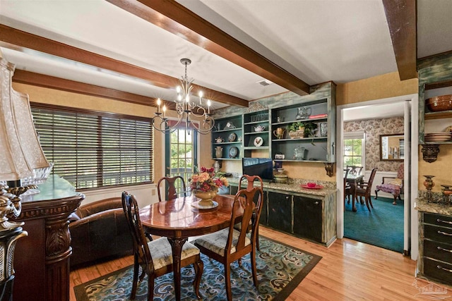 dining space featuring beamed ceiling, an inviting chandelier, and light wood-type flooring