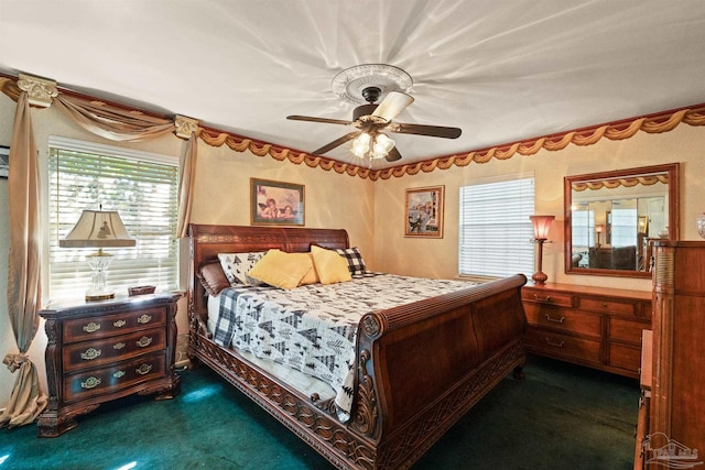 bedroom featuring dark carpet and ceiling fan