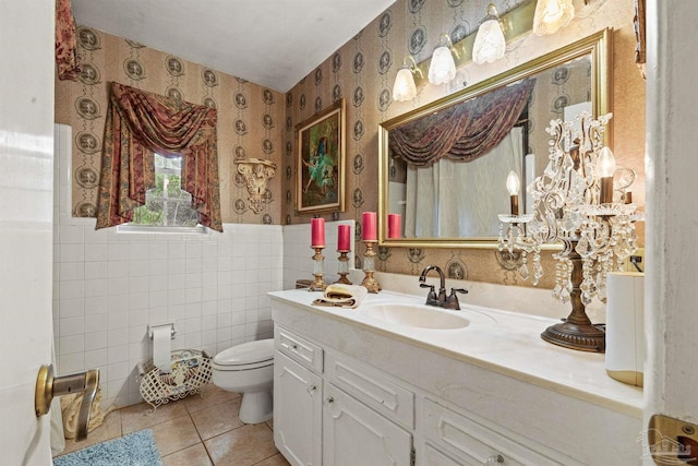 bathroom featuring tile walls, tile patterned flooring, vanity, and toilet