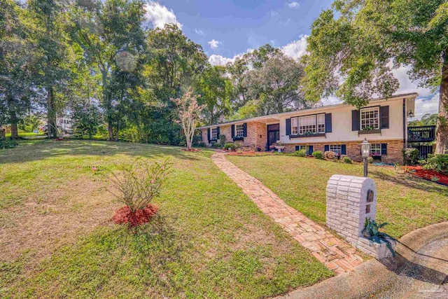 bi-level home with a front yard