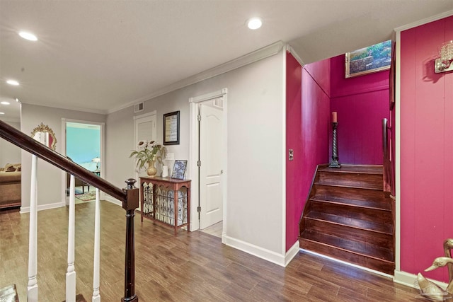 hallway featuring ornamental molding and dark hardwood / wood-style floors