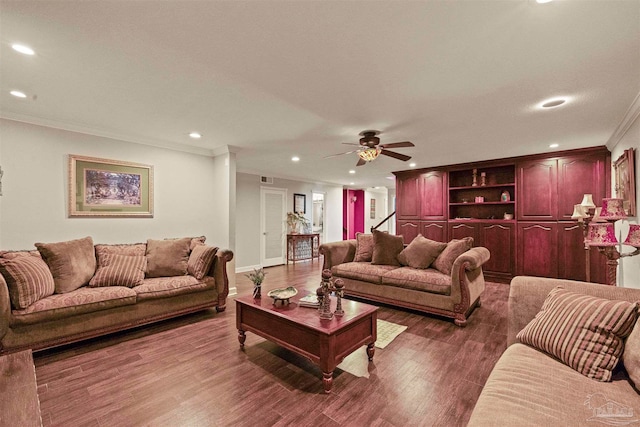 living room with wood-type flooring, ceiling fan, and crown molding