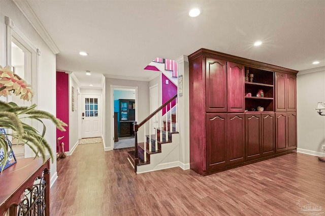 interior space with crown molding and hardwood / wood-style floors