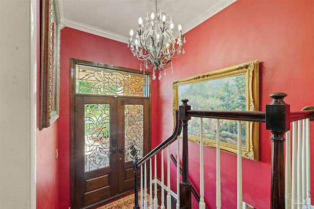 foyer with french doors, an inviting chandelier, and ornamental molding