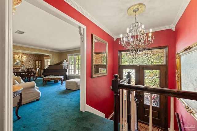 carpeted foyer entrance with an inviting chandelier, french doors, and crown molding