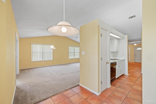 interior space featuring light carpet and lofted ceiling