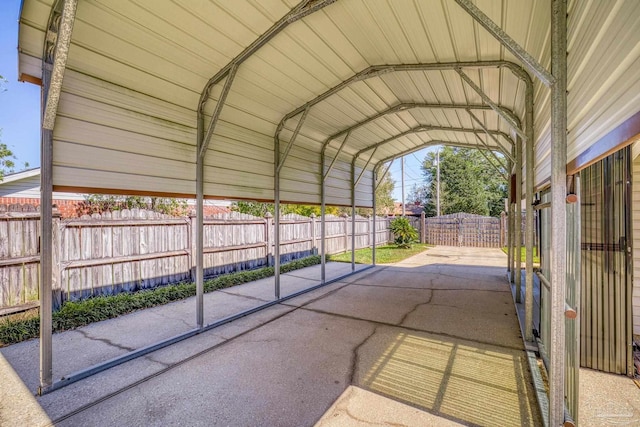 view of vehicle parking with a carport