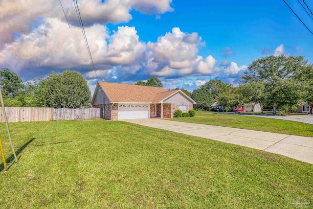 ranch-style home with a front lawn and a garage