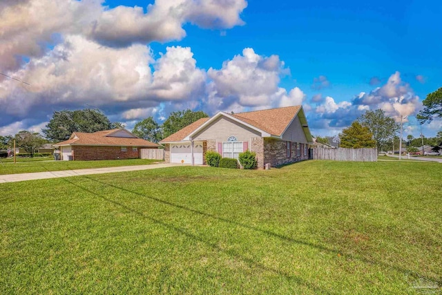 ranch-style house featuring a front lawn and a garage