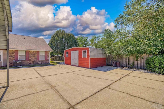 view of patio with a storage unit