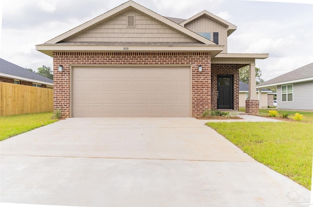 view of front of home featuring a garage and a front lawn