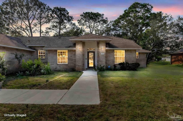 view of front of home with a lawn