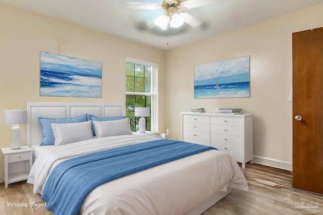 bedroom featuring light hardwood / wood-style floors and ceiling fan