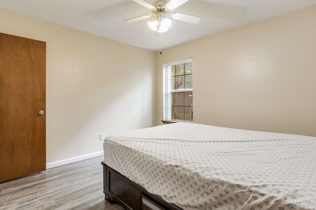 bedroom featuring ceiling fan and hardwood / wood-style flooring