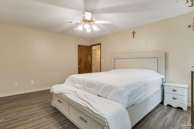 bedroom featuring ceiling fan and dark hardwood / wood-style flooring