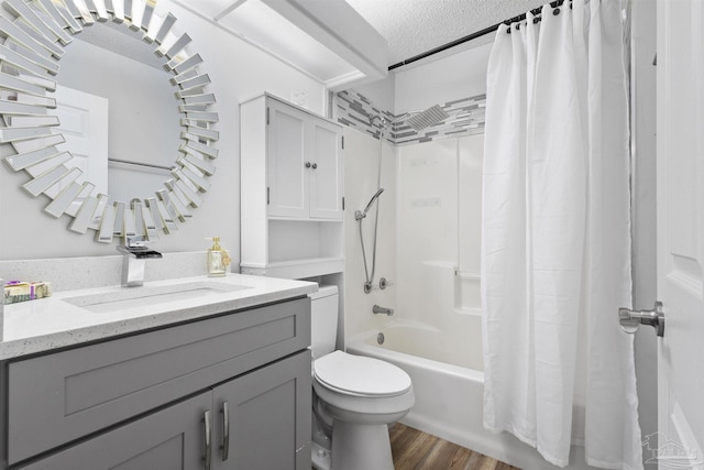 5732 Dove Dr, Pace, FL 32571 - bathroom with shower / bath combo with shower curtain, toilet, vanity, a textured ceiling, and wood finished floors