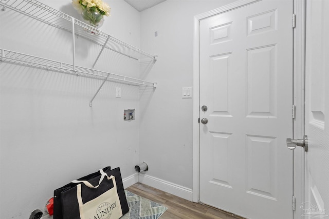 5732 Dove Dr, Pace, FL 32571 - laundry room featuring washer hookup, baseboards, and wood finished floors