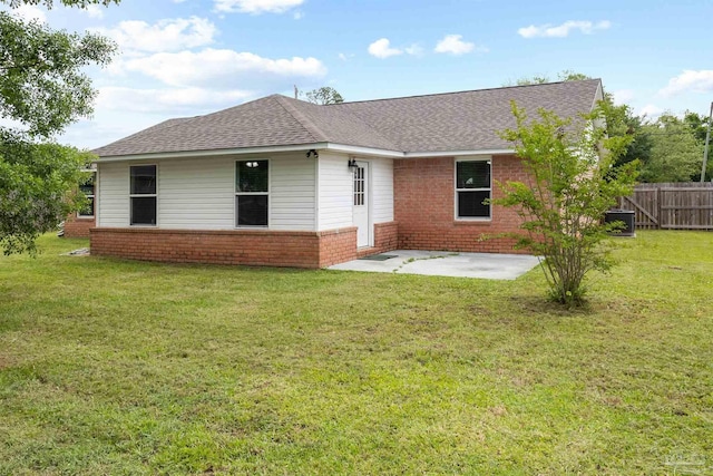 5732 Dove Dr, Pace, FL 32571 - back of house with brick siding, a patio area, and roof with shingles