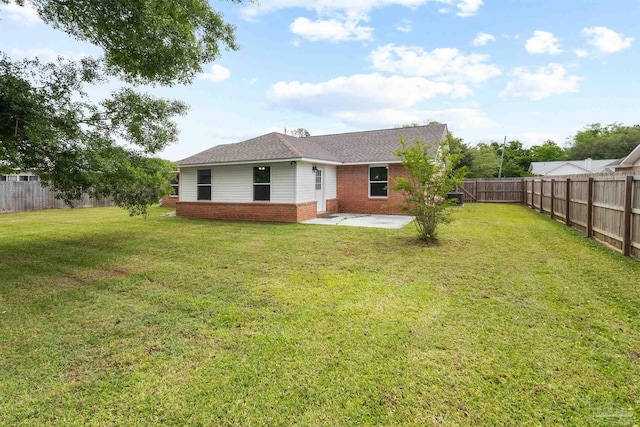 5732 Dove Dr, Pace, FL 32571 - rear view of property with brick siding, a patio area, and roof with shingles
