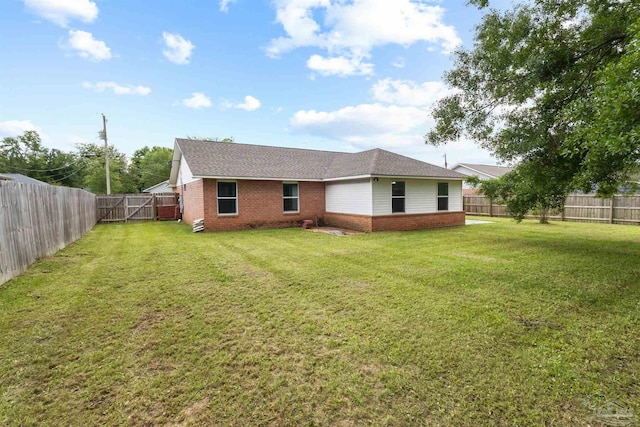 5732 Dove Dr, Pace, FL 32571 - back of house featuring brick siding, a gate, and roof with shingles