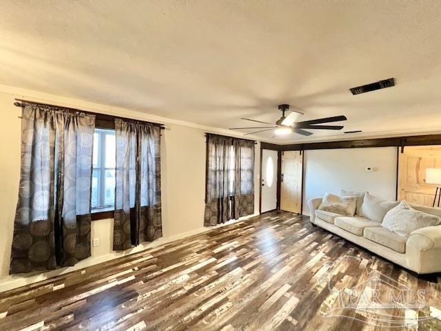 unfurnished living room featuring wood-type flooring and ceiling fan