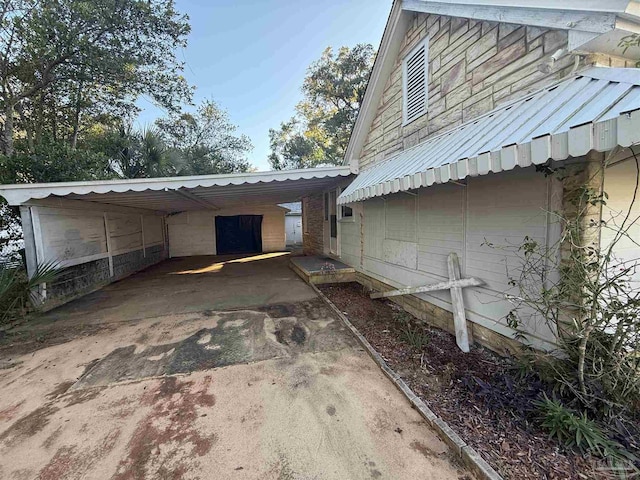 view of side of property with a carport