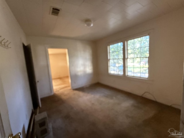 spare room featuring carpet floors