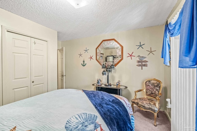 carpeted bedroom featuring a closet and a textured ceiling