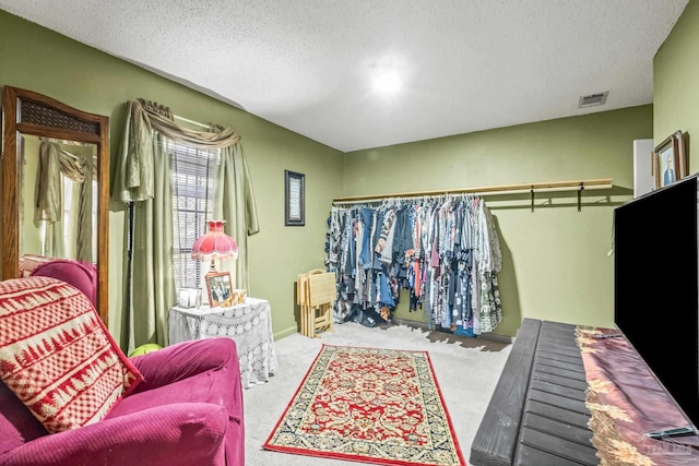 walk in closet with carpet floors