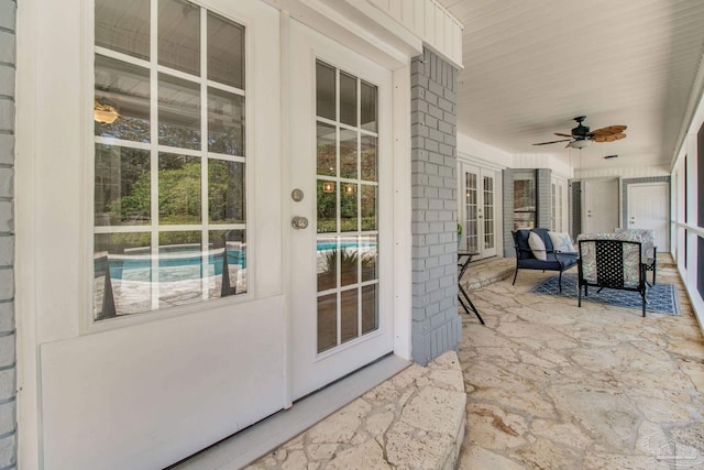 view of patio featuring french doors and a ceiling fan