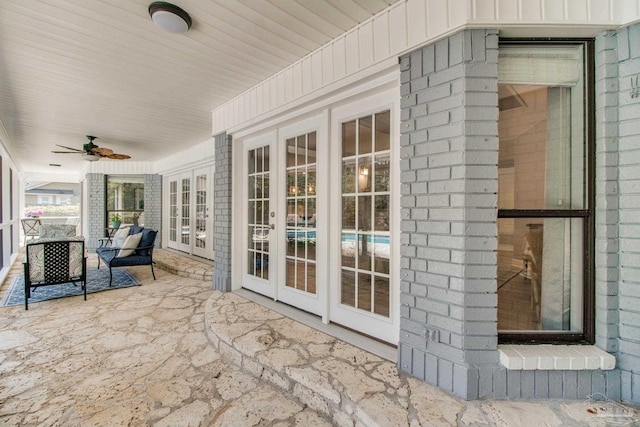 view of patio featuring french doors and a ceiling fan