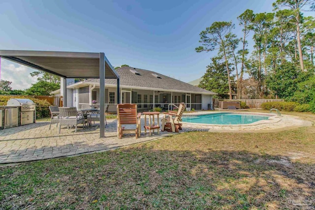 view of pool featuring a patio area, grilling area, a fenced in pool, and fence