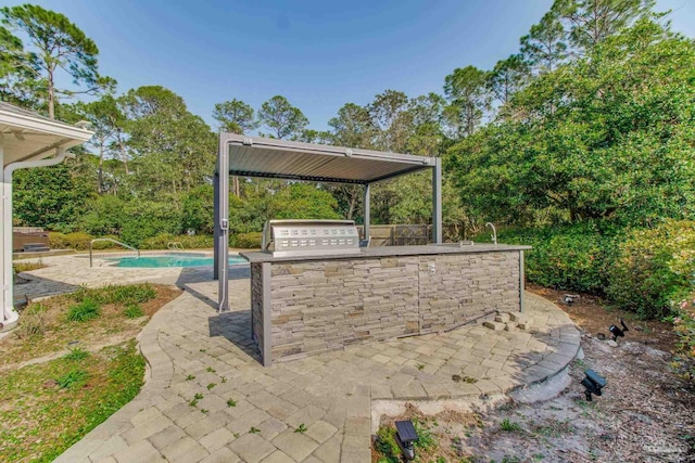 view of patio featuring an outdoor pool, area for grilling, and a grill