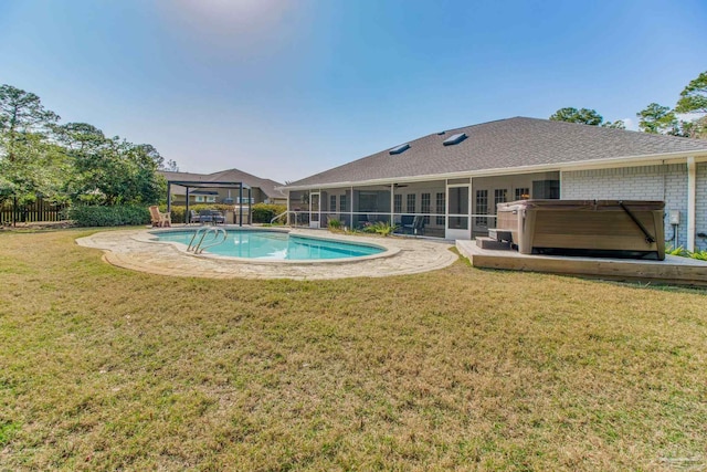 view of swimming pool with a fenced in pool, fence, a lawn, and a hot tub