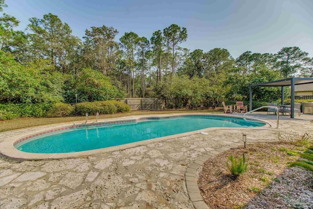 view of pool with a fenced in pool, a patio area, and fence