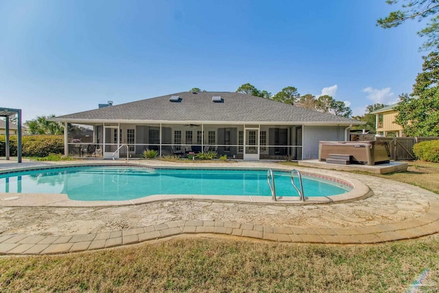 view of pool featuring a fenced in pool, a hot tub, and a sunroom