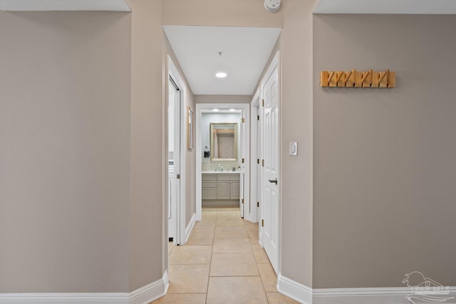 corridor featuring light tile patterned flooring