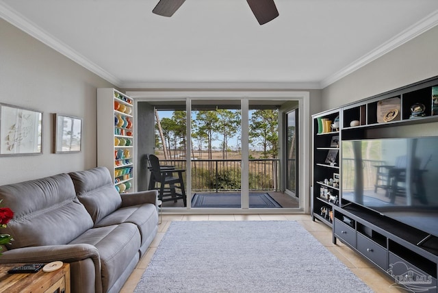 living room with ornamental molding, light tile patterned floors, and ceiling fan