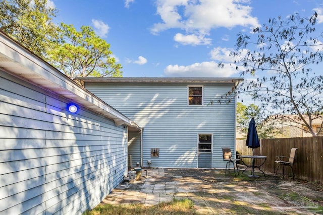 rear view of property featuring a patio area