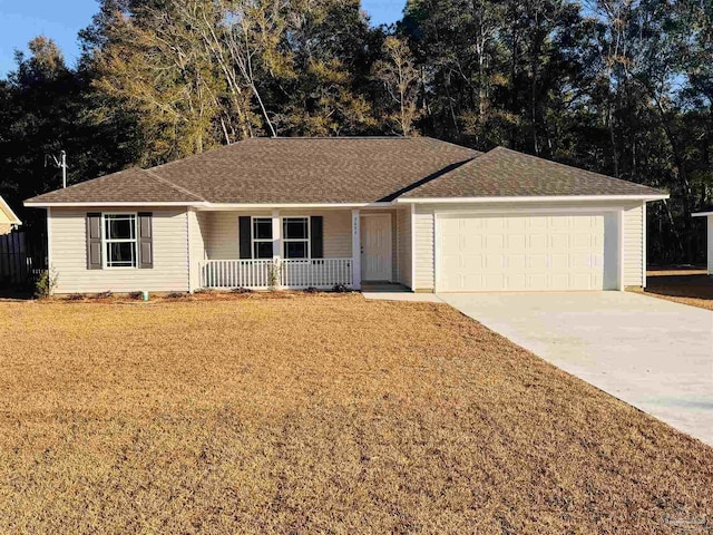 ranch-style home with a garage, a front lawn, and covered porch