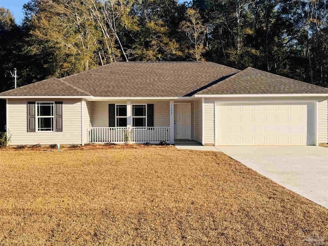 ranch-style house featuring a garage, covered porch, and a front lawn